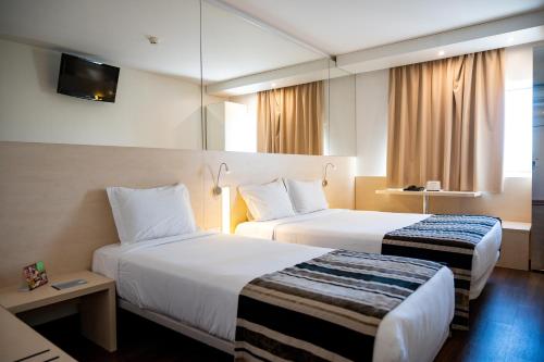 Habitación Doble con cama supletoria del hotel Park Porto Aeroporto