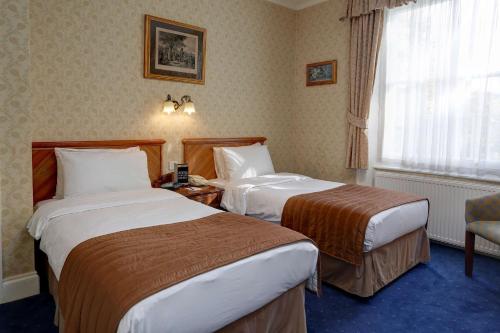 Habitación Doble Estándar - 2 camas del hotel Best Western Swiss Cottage. Foto 1