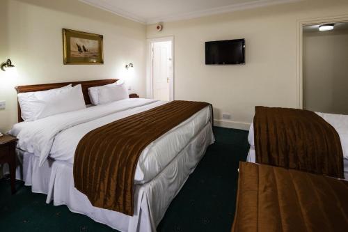 Habitación Familiar - 1 cama doble y 2 camas individuales del hotel Best Western Swiss Cottage. Foto 2
