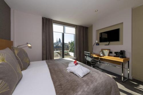 Habitación King con balcón del hotel Apex Temple Court. Foto 1