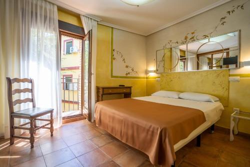 Habitación Doble - 1 o 2 camas del hotel Yit Puerta Bisagra. Foto 1