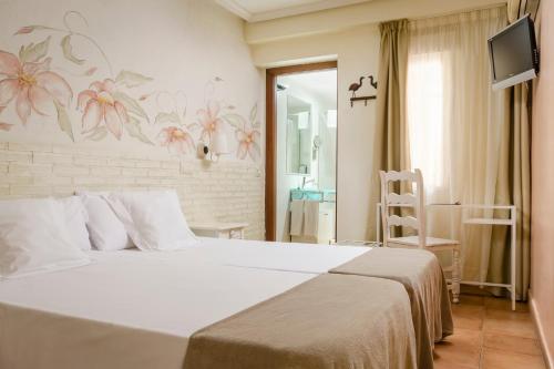 Habitación Doble - 1 o 2 camas del hotel Yit Puerta Bisagra. Foto 7