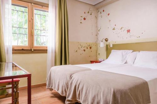 Habitación Doble - 1 o 2 camas del hotel Yit Puerta Bisagra. Foto 8