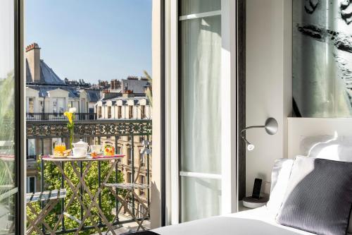 Habitación Doble Executive con balcón del hotel Hôtel Marais Grands Boulevards