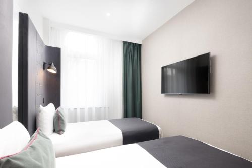 Habitación Doble con 2 camas, acogedora y con vistas del hotel Point A Hotel King Cross - St Pancras. Foto 2
