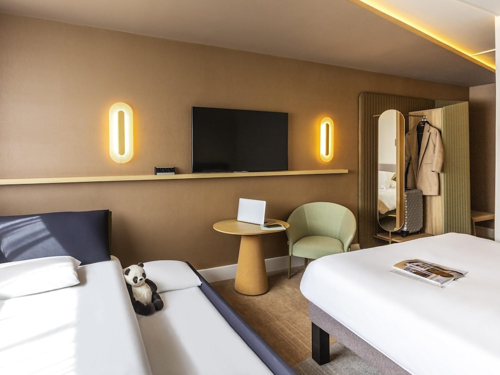 Habitación familiar, varias camas del hotel Novotel Nancy. Foto 1