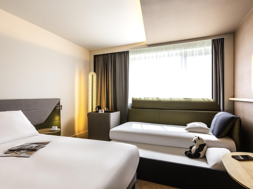 Habitación familiar, varias camas del hotel Novotel Nancy. Foto 4