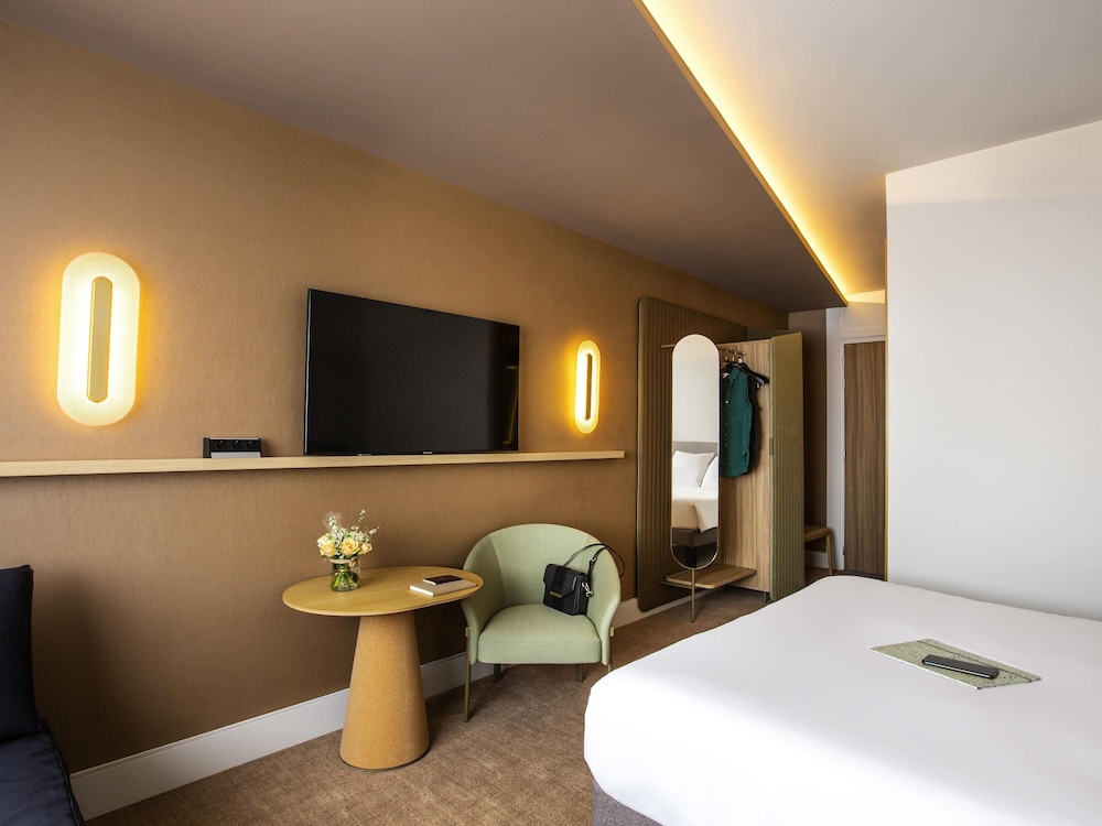 Habitación clásica, varias camas del hotel Novotel Nancy. Foto 2