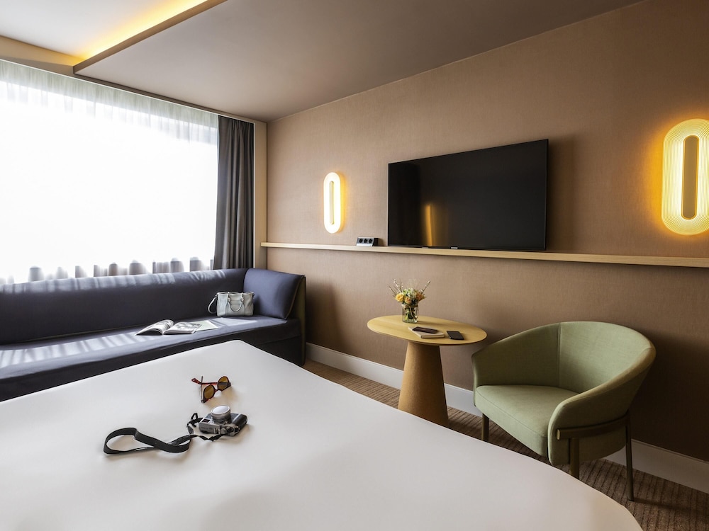 Habitación clásica, varias camas del hotel Novotel Nancy. Foto 5