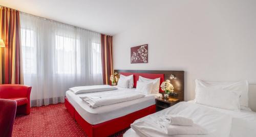 Habitación Triple Confort del hotel PLAZA INN Amedia Vienna. Foto 2