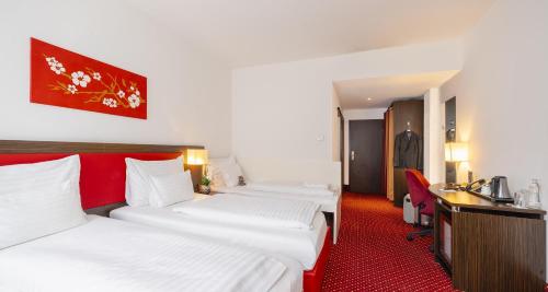 Habitación Triple Confort del hotel PLAZA INN Amedia Vienna. Foto 3