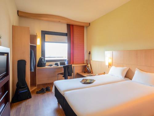 Habitación Estándar - 2 camas individuales del hotel Ibis Milano Malpensa Aeroporto. Foto 6