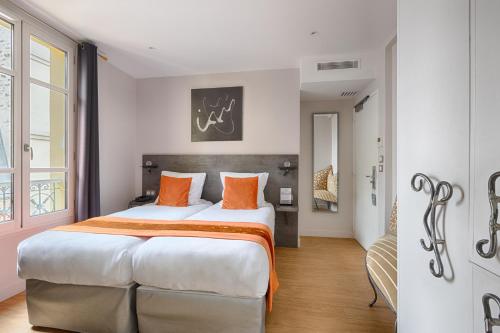 Habitación Doble - 2 camas del hotel De France Invalides. Foto 2