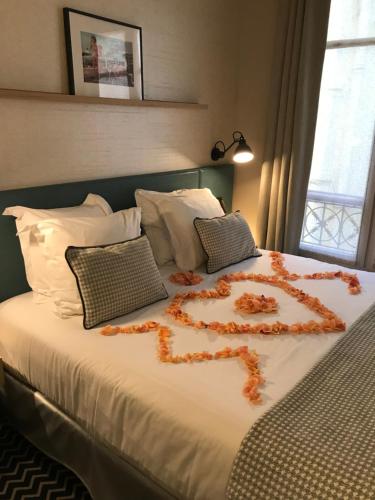 Habitación Doble del hotel De France Invalides. Foto 1