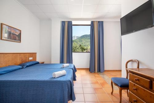 Habitación Cuádruple del hotel Hospedería Santuari de Lluc. Foto 2