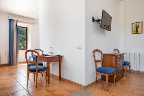 Habitación Cuádruple del hotel Hospedería Santuari de Lluc. Foto 3