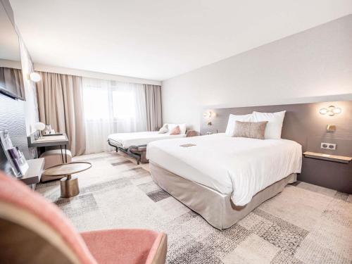 Habitación Doble Superior con vistas al jardín del hotel Mercure Bordeaux Lac. Foto 4