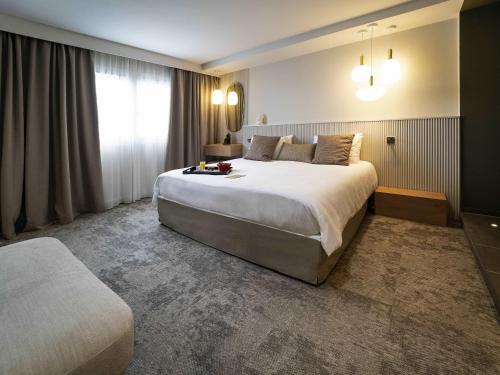Superior King Suite with Sofa - Garden Side del hotel Mercure Bordeaux Lac. Foto 3