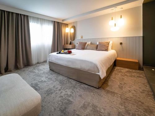Superior King Suite with Sofa - Garden Side del hotel Mercure Bordeaux Lac. Foto 7