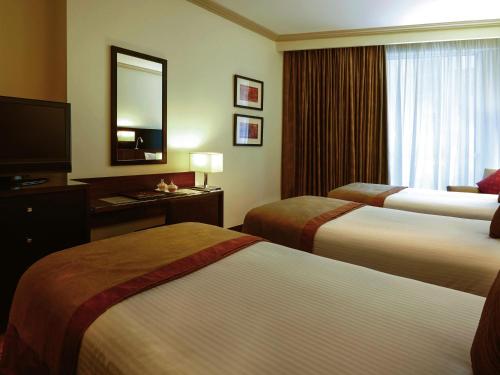 Classic Room with Four Single Beds del hotel Mövenpick and Residence Hajar Tower Makkah