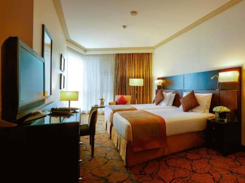 Classic Room with Four Single Beds del hotel Mövenpick and Residence Hajar Tower Makkah. Foto 2