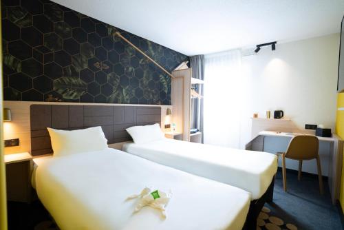 Habitación Familiar con 2 camas dobles del hotel Ibis Styles Strasbourg Nord Palais des Congrès. Foto 3