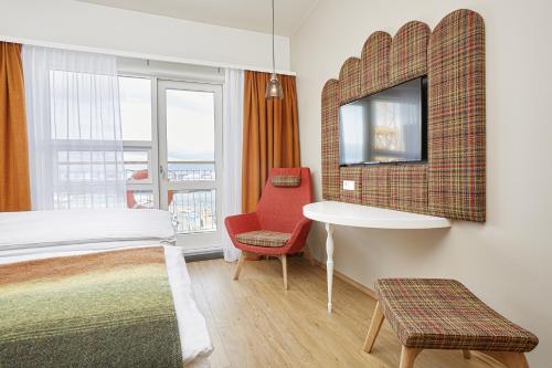 Habitación Doble Deluxe con vistas al mar del hotel Reykjavik Marina - Berjaya Iceland Hotels. Foto 2