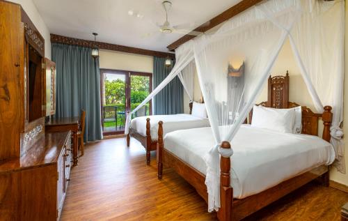 Habitación Doble con vistas al jardín - 2 camas del hotel Nungwi Beach Resort by Turaco. Foto 2