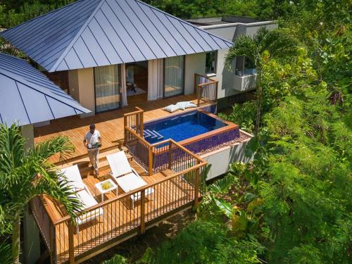Villa Doble con piscina en la ladera y vistas al jardín del hotel Raffles Seychelles. Foto 1