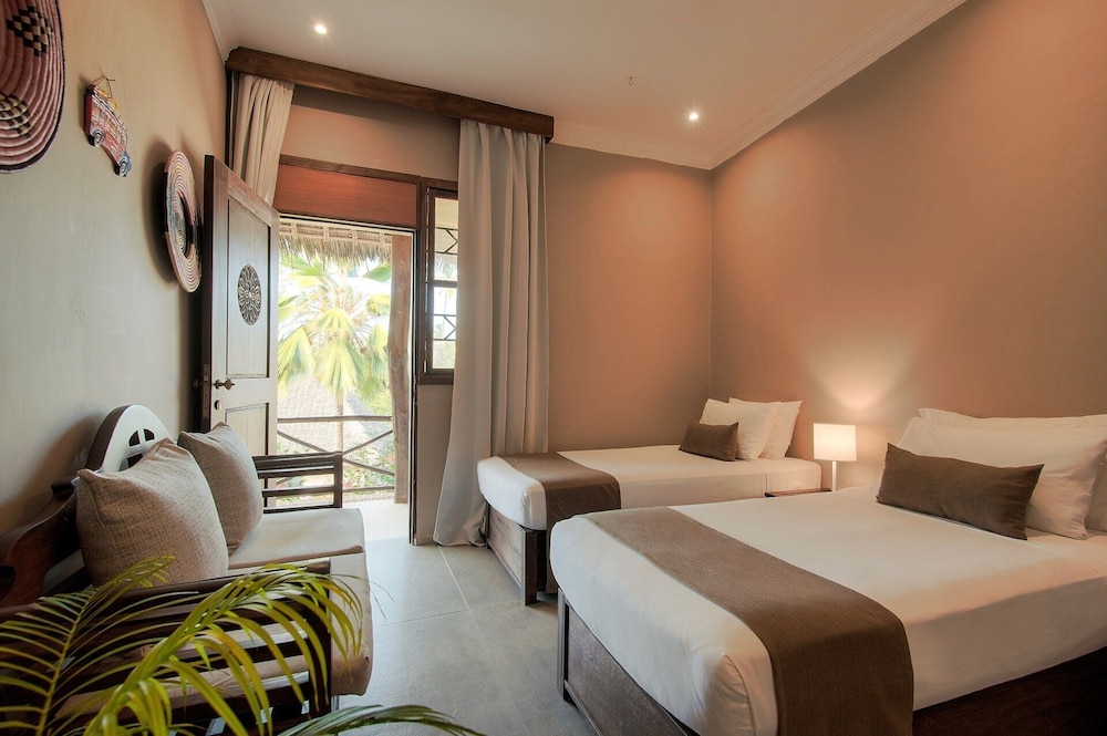 Habitación Cuádruple Superior del hotel Diamonds Mapenzi Beach. Foto 1