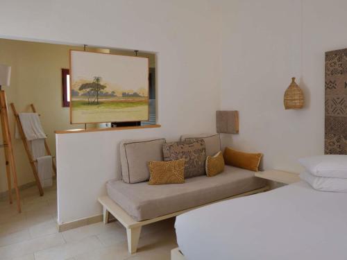 Habitación Doble Estándar del hotel Movenpick Resort Lamantin Saly. Foto 2