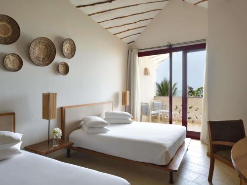 Habitación Familiar - 2 camas grandes del hotel Movenpick Resort Lamantin Saly. Foto 3