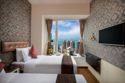 Habitación Doble Deluxe con vistas al puerto del hotel Ramada by Wyndham Hong Kong Harbour View