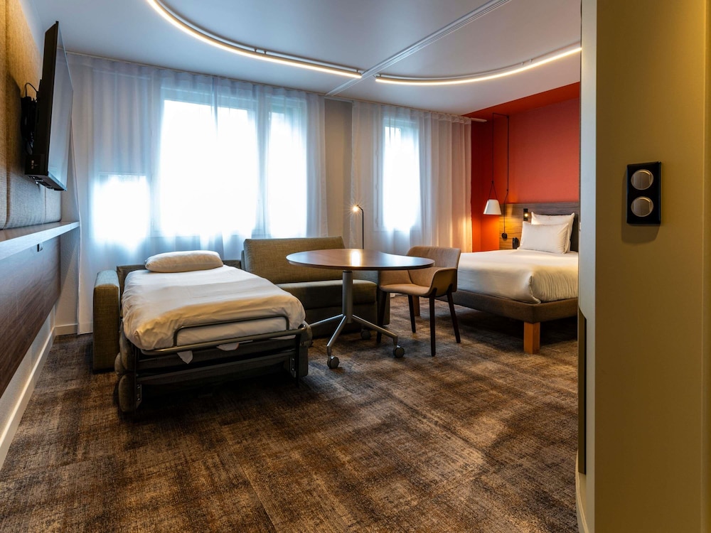 Suite Clásica - cama queen - size y sofá - cama individual del hotel Novotel Suites Reims Centre. Foto 14