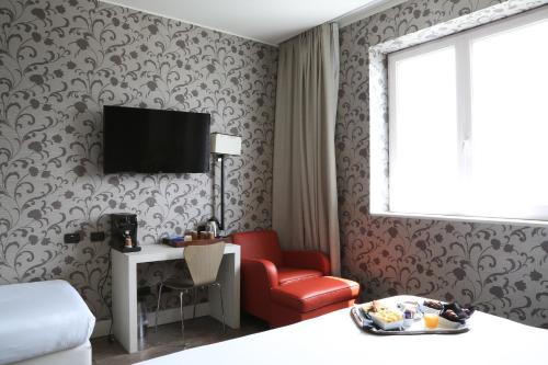 Habitación Triple del hotel Klima Milano Fiere. Foto 4
