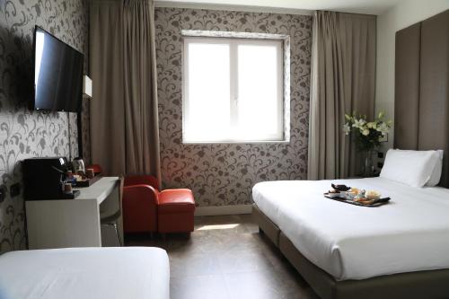 Habitación Triple del hotel Klima Milano Fiere. Foto 3