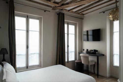 Habitación Doble Confort del hotel SAINT LOUIS EN L'ISLE. Foto 4