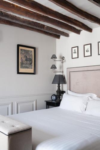 Habitación Triple Deluxe con balcón del hotel SAINT LOUIS EN L'ISLE