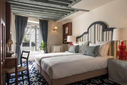 Habitación Deluxe del hotel Saint Germain Des Pres. Foto 1