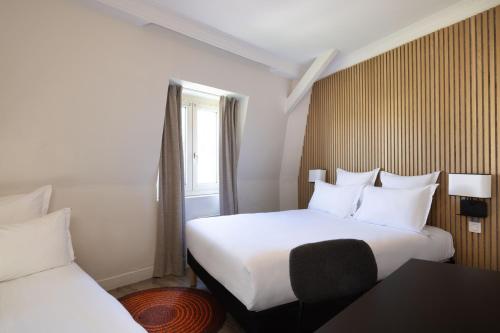 Habitación Triple del hotel Korner Montparnasse. Foto 4