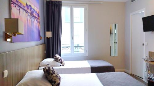 Habitación Doble - 2 camas del hotel Avia Saphir Montparnasse. Foto 5