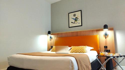 Habitación cuádruple del hotel Avia Saphir Montparnasse. Foto 1