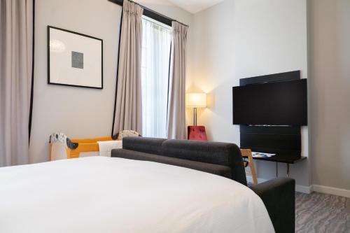 Habitación Familiar con sofá cama - Cama grande del hotel Doubletree By Hilton London - Greenwich. Foto 8