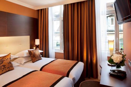 Habitación Doble SUPERIOR COMFORT – Vista a la ciudad del hotel 85 Saint Honore. Foto 1
