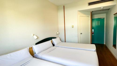 Habitación Triple del hotel Iris Guadalajara. Foto 4