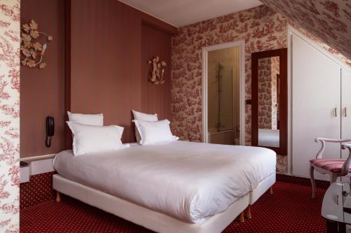Deluxe Double or Twin Room with Partial Eiffel Tower or Sacré Coeur View del hotel Regyn's Montmartre. Foto 4