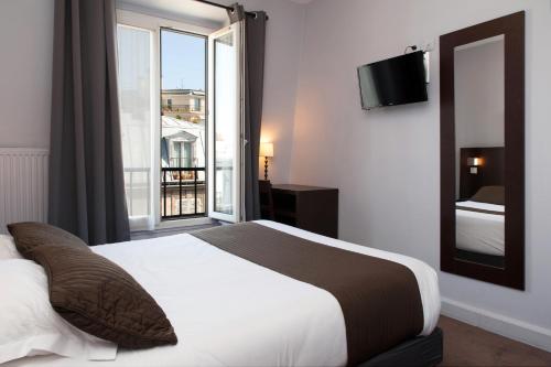 Habitación Clásica del hotel Odessa Montparnasse. Foto 1