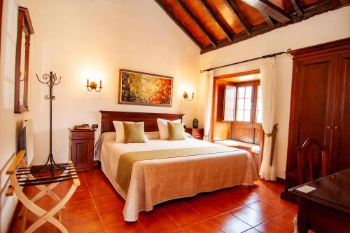 Triple room del hotel Hotel Rural Jardines de Milano - Adults Only. Foto 13