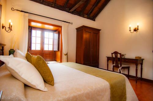 Triple room del hotel Hotel Rural Jardines de Milano - Adults Only. Foto 21