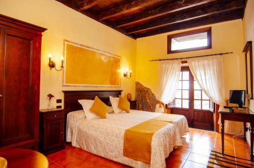 Twin room del hotel Hotel Rural Jardines de Milano - Adults Only. Foto 7